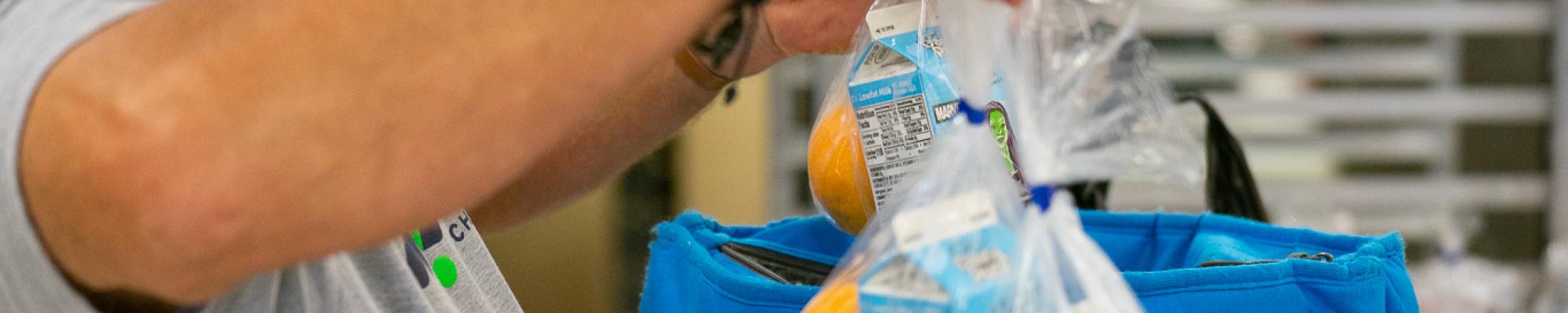 Bill Gann loading cold bags at Meals on Wheels Wichita County
